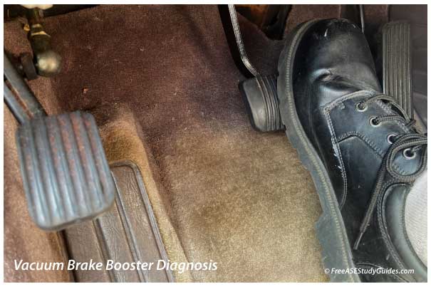 Technician applying the brake pedal.