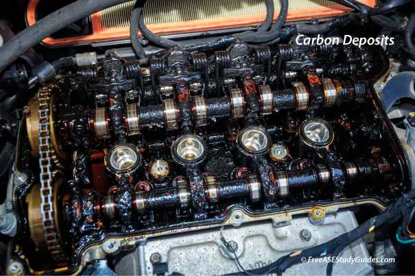 Cylinder head with hardened carbon buildup.